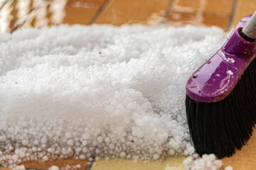 cleaning a graupel with Floor broom, hail on floor