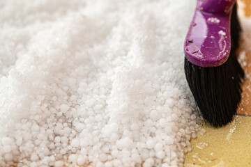 cleaning a graupel with Floor broom, hail on floor