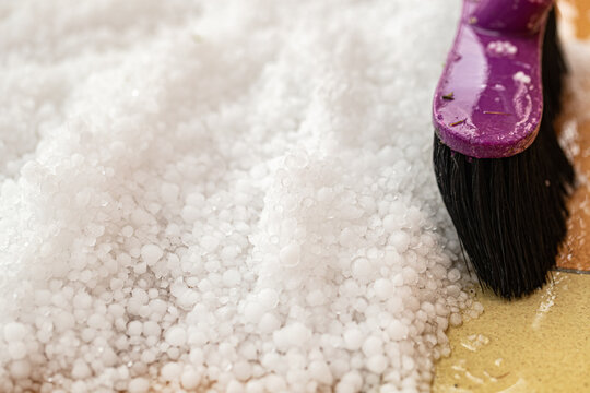 cleaning a graupel with Floor broom, hail on floor