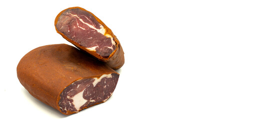 Turkish pastrami on a white background. Bacon made from veal. Turkish bacon, pastrami (Kayseri pastirma). Empty space for text. copy space