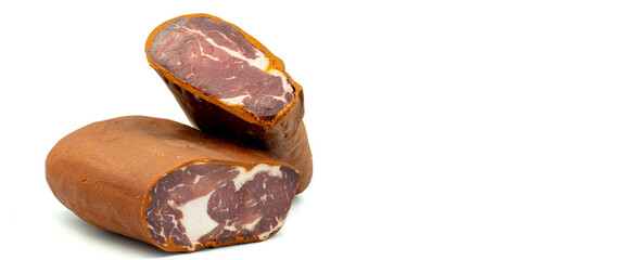 Turkish pastrami on a white background. Bacon made from veal. Turkish bacon, pastrami (Kayseri pastirma). Empty space for text. copy space