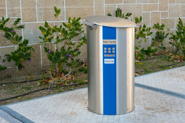 Waste paper recycling trash can on the streets of Castelo Branco Portugal