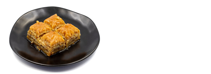 Walnut Baklava on white background. Turkish style walnut baklava presentation and service. Empty space for text. Copy space