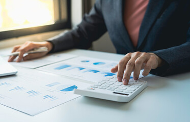 business woman analyzing company performance graph Make market research reports and revenue statistics. to generate profits and growth Finance and Accounting Concepts