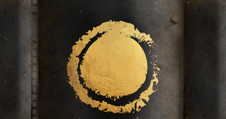 Image of distressed gold circle and ring design on black with falling snow