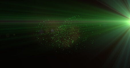 Fototapeta na wymiar Image of green light beams with christmas and new year fireworks exploding in night sky