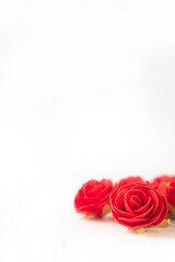 Bunch of velvet red roses isolated on white background .Roses Art Design . Frame made roses, green leaves Valentine's background with roses. Valentines day card concept. romantic