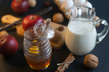 Honey and other ingredients and spices for a birthday cake.