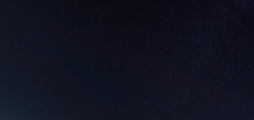 Naklejka na ściany i meble Panorama blue night sky milky way and star on dark background.