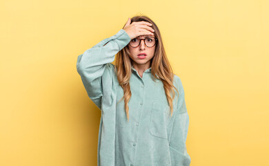 pretty caucasian woman panicking over a forgotten deadline, feeling stressed, having to cover up a...