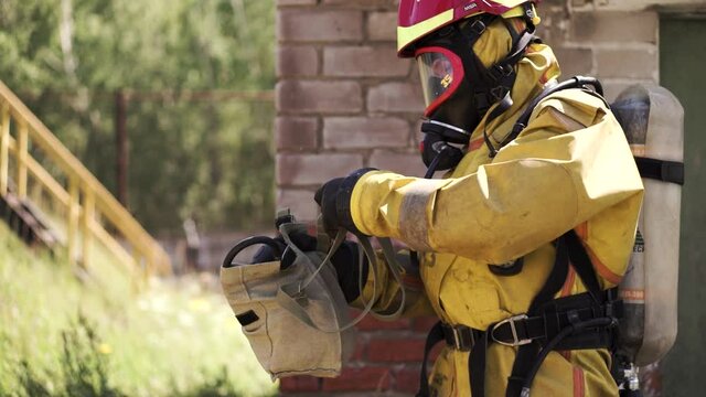 Workflow. Gas mask. Clip. Men in gas masks in the working environment .