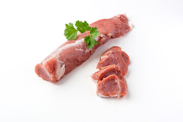 Raw pork tenderloin meat on a white background