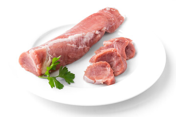 Raw pork tenderloin meat on a white background