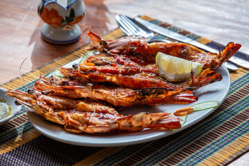 Grilled tiger prawns on the plate in a fish restaurant in Ngapali, Myanmar, Burma