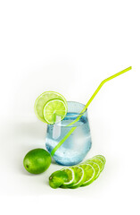 Lemon juice glass and fresh lemons. Isolated on white background