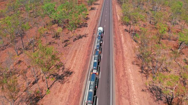 Outback road train Australia. Roadtrain truck trailer aerial view. Long vehicle