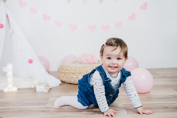 Cute girl crawling on floor at home