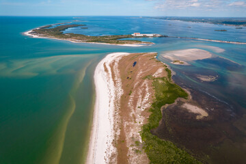 Fototapeta na wymiar Island. Florida beach. Panorama of Honeymoon Island State Park and Caladesi Island. Blue-turquoise color of salt water. Ocean or Gulf of Mexico. Summer vacations in USA. Tropical Nature. Aerial view