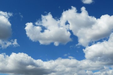 Naklejka na ściany i meble Beautiful heart shape cloud in blue sky, natural clouds background