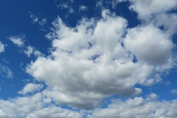Naklejka na ściany i meble Beautiful blue sky with big white fluffy clouds
