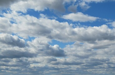 Blue sky with beautiful white cumulus clouds, natural background