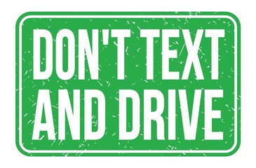 DON'T TEXT AND DRIVE, words on green rectangle stamp sign