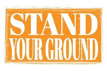 STAND YOUR GROUND, words on orange grungy stamp sign