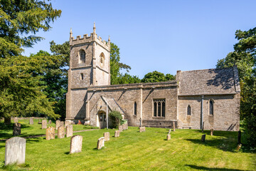 Fototapeta na wymiar The 12th century Norman church of St Andrew in the Cotswold village of Cold Aston (aka Aston Blank), Gloucestershire UK