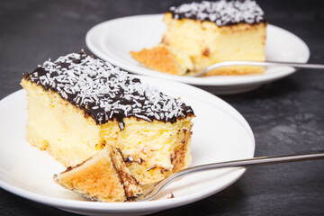 Portion of fresh baked cheesecake on plate. Delicious dessert