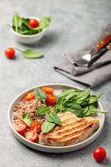 Turkey steak or chicken with buckwheat and spinach leaf salad and tomatoes.  Diet food.