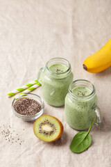 Diet drink smoothie of banana, kiwi, spinach and chia seeds. Vegan food.