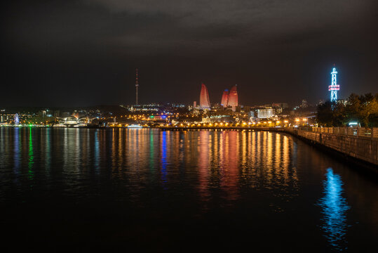 night photo of the waterfront of Baku, Azerbaijan, with the famous flame towers