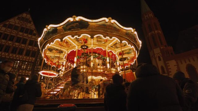 Christmas market in Frankfurt am Main with the carousel in the evening