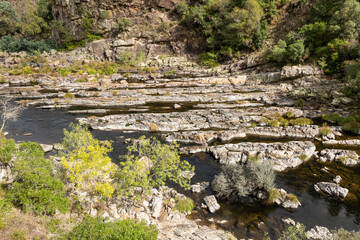 detail of the rocky river bank of Paiva river at Arouca Geopark, Municipality of Arouca, Aveiro...