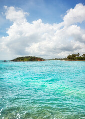 Obraz na płótnie Canvas Tropical island seen from water on a sunny summer day, Sri Lanka.