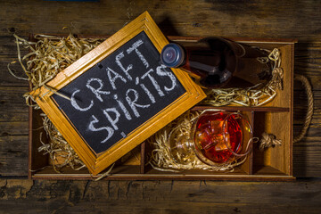 Craft spirit alcohol. Various bottles and glass with hand crafted hard strong alcohol drinks. Old...