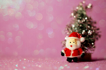christmas background santa claus next to the christmas tree