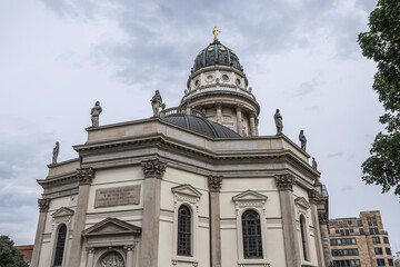 Fototapeta na wymiar Architectural fragments of New Church (Neue Kirche or Deutscher Dom, 1708) at the Gendarmenmarkt across from French Church. Berlin, Germany.