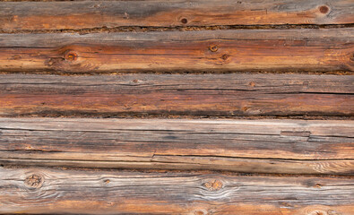 Old grey and brown wooden background with cracks and scratches in vintage style