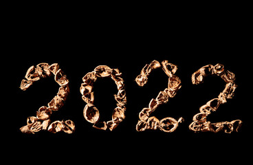 2022 new year. Numbers made from a pile of nutshells. Food style calendar. Wallpaper. Banner. Brown color walnut texture. Signed two and zero. Flat lay mockup design. Business card. Black background