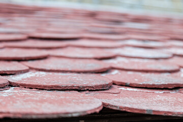 Roofing construction with attic skylights, rain gutter system, roof windows and roof protection from snow board, snow guard exterior. Modern House Construction. Hip and Valley roofing types