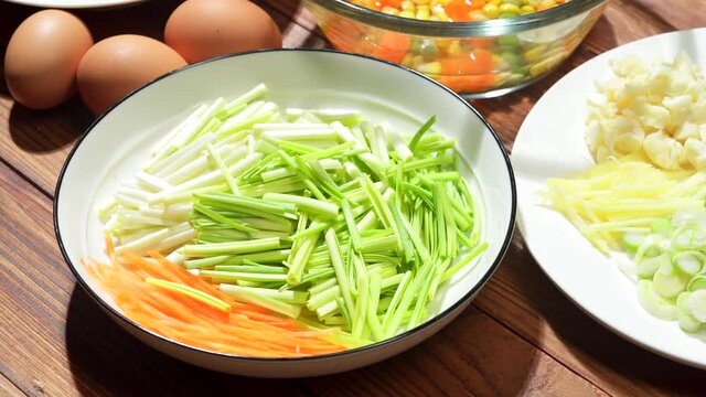 Chinese style home-cooked stir-fry with garlic sprouts and scrambled eggs