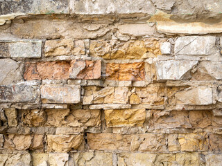 Brown brick wall. Damaged destroyed surface.