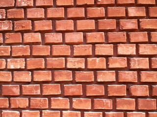 Obraz premium Bright red wall. Colorful background with brick texture.