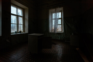 Dark and creepy room of old abandoned mental hospital at night