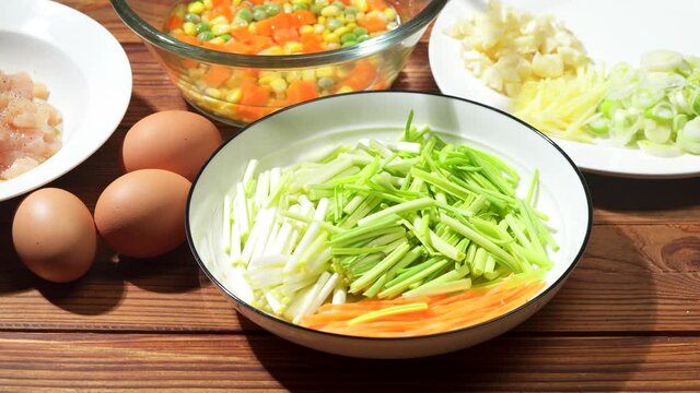 Chinese style home-cooked stir-fry with garlic sprouts and scrambled eggs