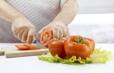 fresh tomatoes on green lettuce