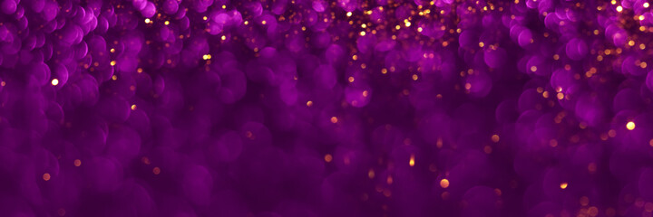 Violet and golden sparkling glitter background, christmas texture. Holiday lights. Abstract defocused header. Wide screen wallpaper. Panoramic web banner with copy space for design