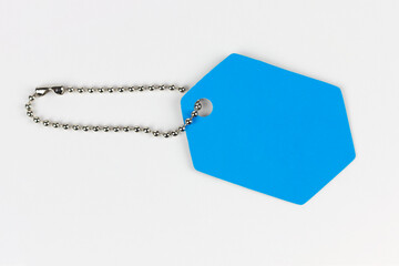 Blue tag with chain on white background