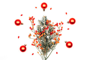 Bouquet of fir branches with red berries and Christmas decorations - obrazy, fototapety, plakaty